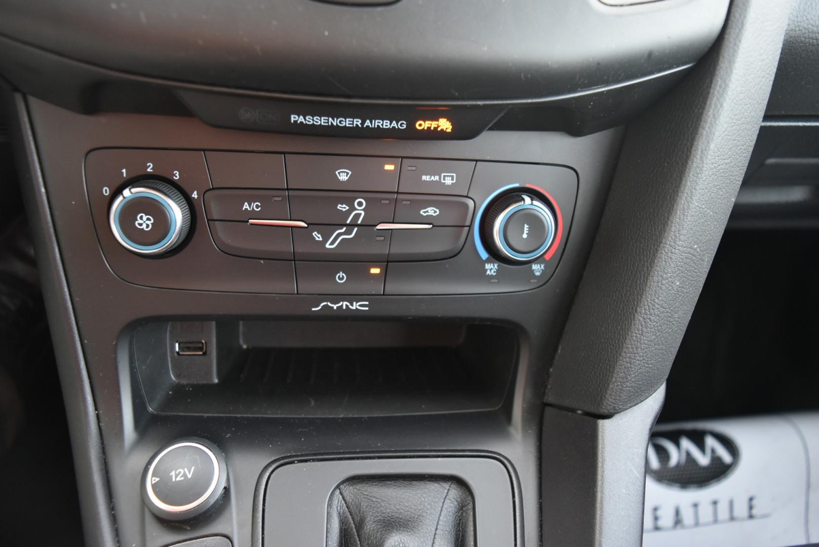 2016 Gray /Black Ford Focus SE (1FADP3F26GL) with an 2.0L I-4 GDI TI-VCT FLEX FUEL engine, 6-Speed Powershift Automatic transmission, located at 1600 E Hwy 44, Rapid City, SD, 57703, (605) 716-7878, 44.070232, -103.171410 - Photo#20